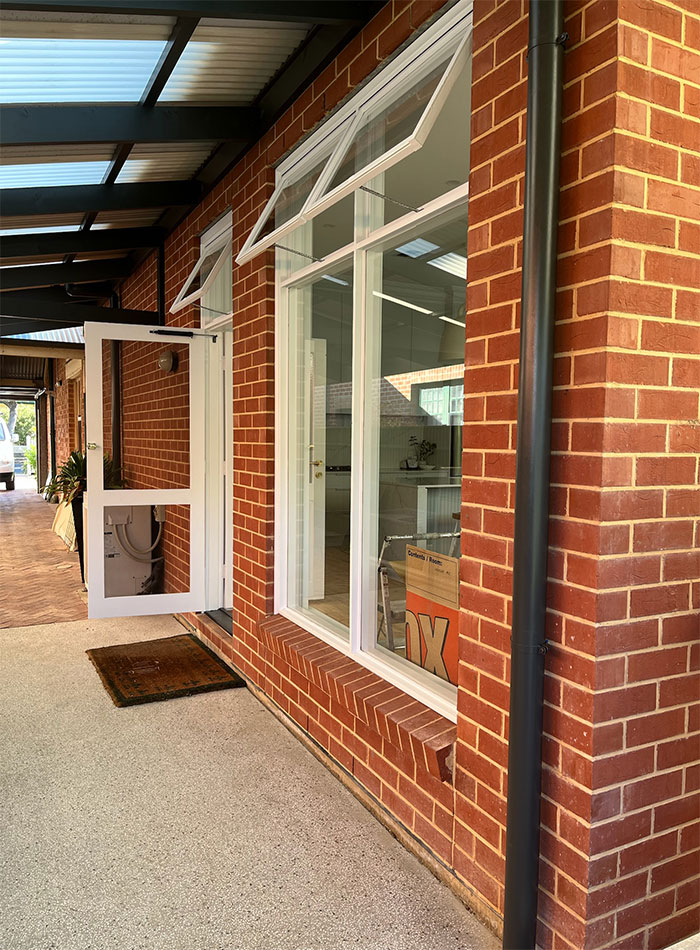 Refined Painting preparing a home exterior for repainting in Adelaide